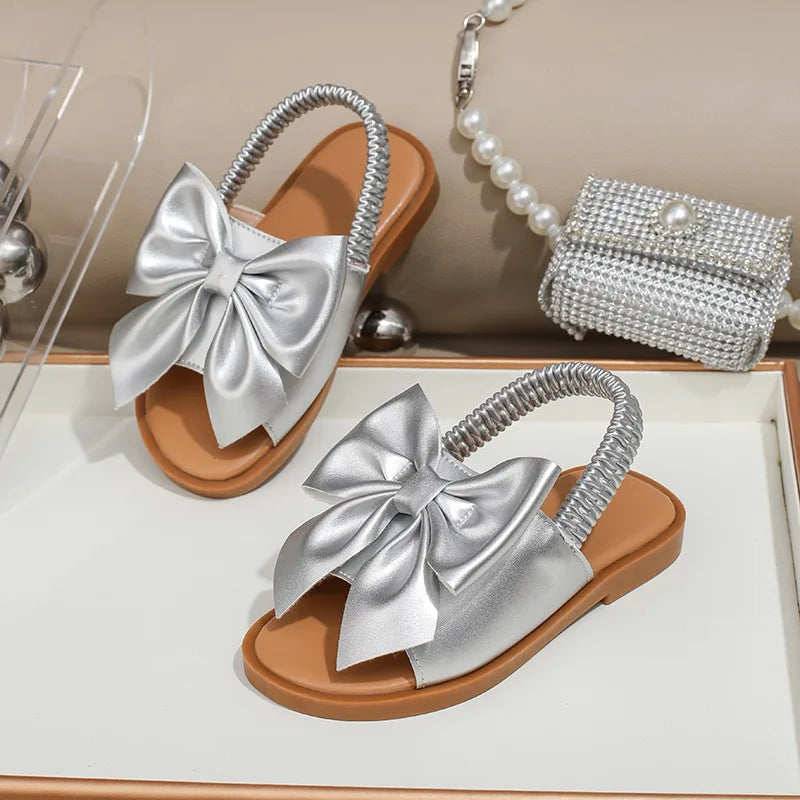 Children's sandals summer new hollow out walking shoes flat sandals cross-border hot selling butterfly knot elastic band sandals